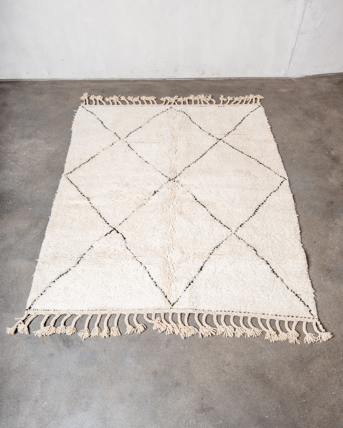 Modern, designer, handcrafted Berber rug from Morocco. Beniourain carpet with minimalist design, natural wool pile and a fluffy texture.